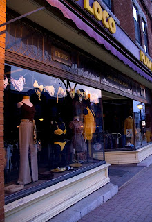the plum loco clothing shop in downtown orillia with deep plum colored overhead signage