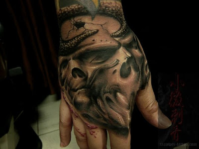 Tattoo Pics on Hand Free Tattoo Design  Skull Tattoo Designs