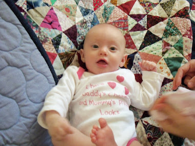 Cara on Kaleido quilt at Grans house