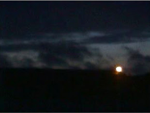 Photography of moon in the clouds.