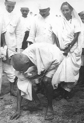 During salt Satyagraha Mahatma Gandhi picking salt on the beach at Dandi 