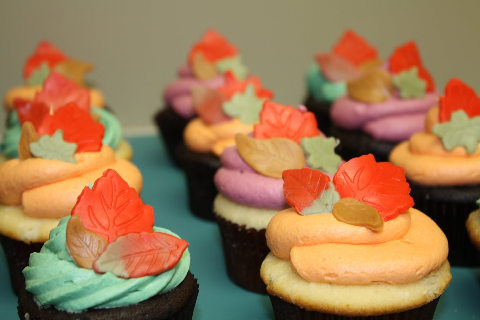 Two Sweet Bakery Fall cupcakes with fondant leaves; leaf sugar cookies
