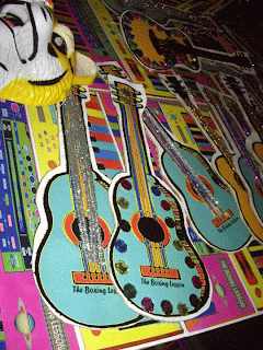 cardboard guitar props by Jaylinn Davidson for The Boxing Lesson party