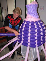 Putting the finishing touches on new designer balloon gown line.