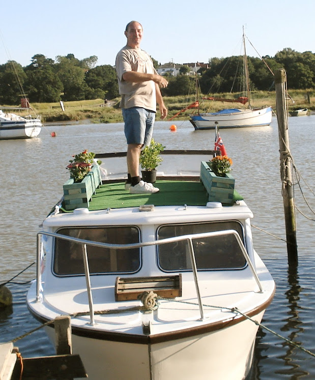 Safely in its mooring, with a few potplants