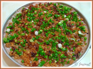 Home-cooked Nonya Yam Cake in a rounded container