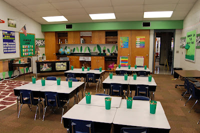jungle theme classroom, with green cups on desks.