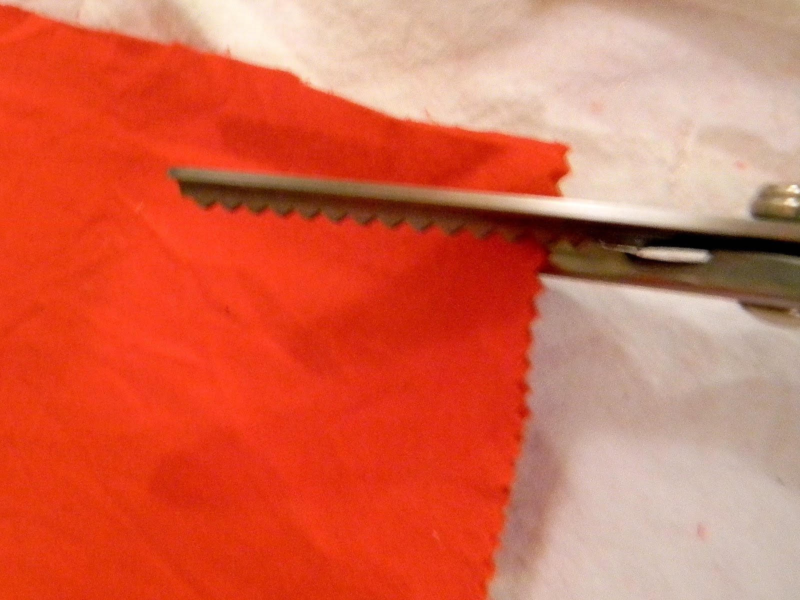 I cut a small strip of complimentary fabric with my pinking shears and