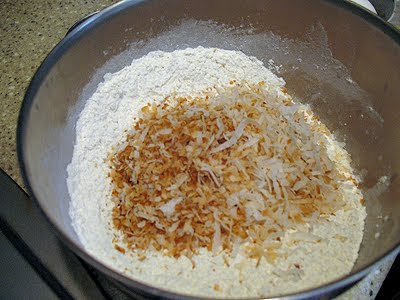 A bowl of flour and toasted coconut.