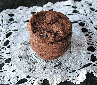 A close up photo of a stack of world peace cookies on a clear plate