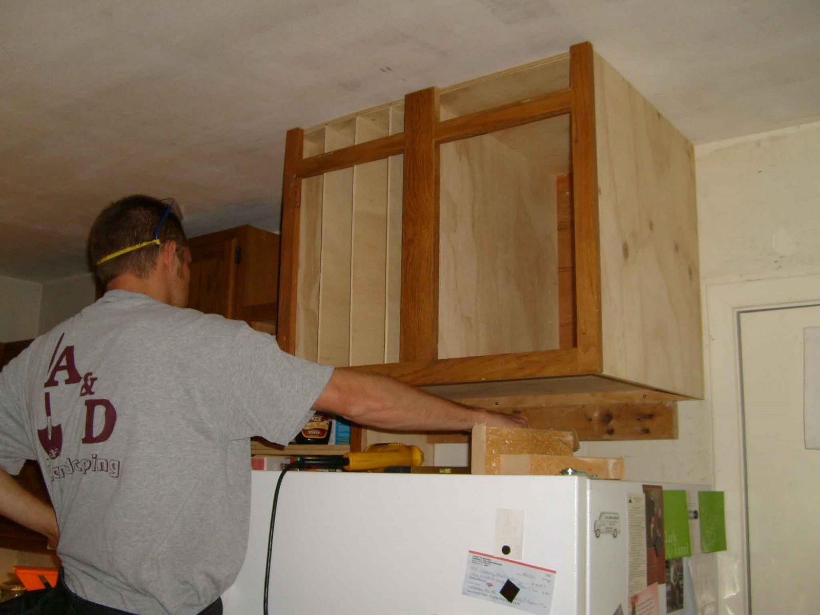 [Justin+installing+cabinet.jpg]
