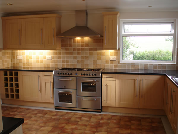 Kitchen Wall Tiles The multi shaded wall tiles pull this large fitted kitchen with central