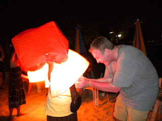 lighting a khom fai in Phuket, Thailand