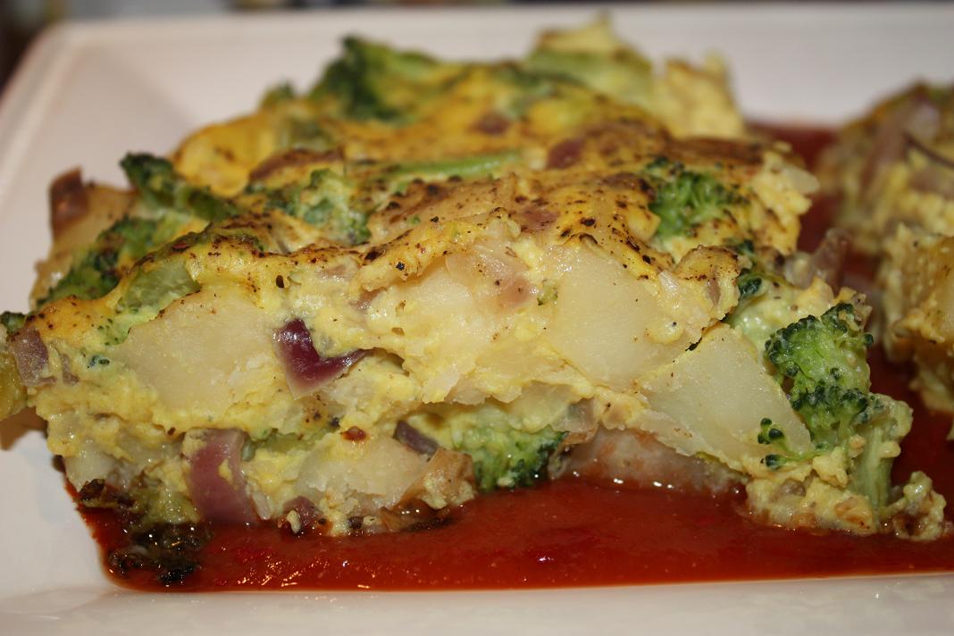 Vegan Epicurean Broccoli, Potato, and Onion Frittata on a bed of