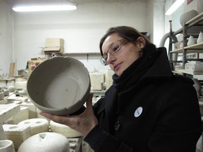 Katia examining a bowl