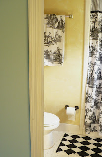 decorating a small master bathroom with black and white toile