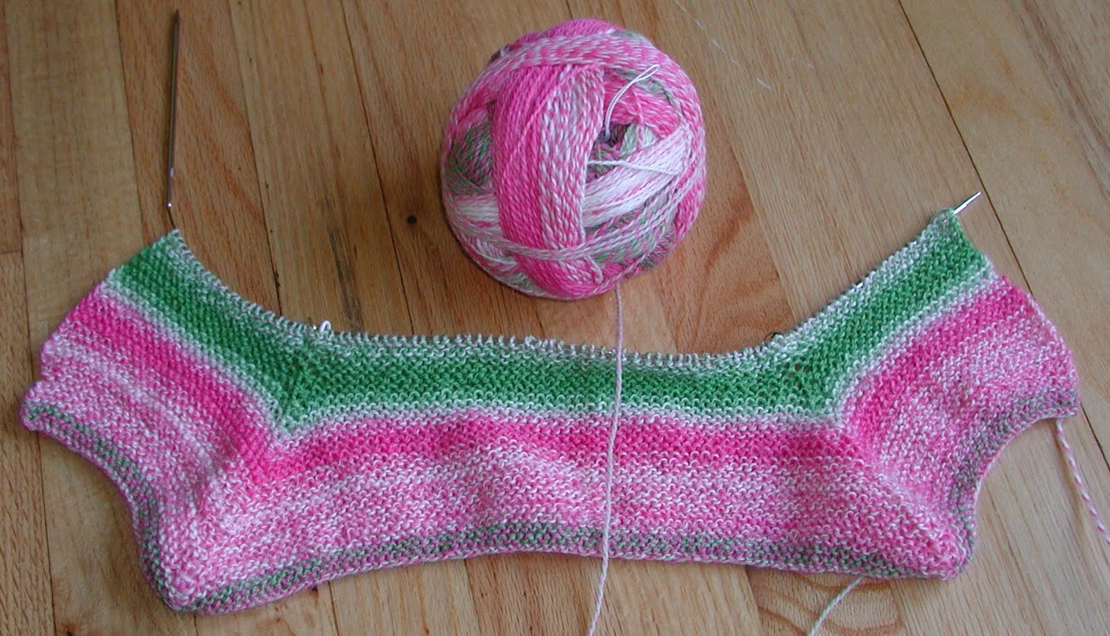 EZs Surplice Baby Jacket - Knitting-and.com free knitting patterns