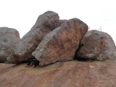 Avi resting at summit of bhairavadurga. A perfect boulder massage