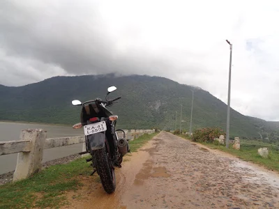 Sippy's bike resting well top upon the bund of Gundal dam
