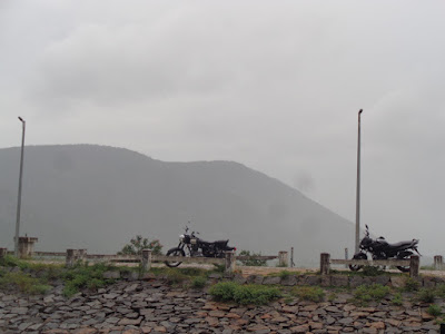 The bikes rest as the wash the dirt and cool it down