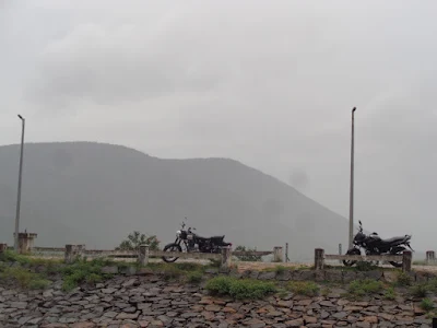 The bikes rest as the wash the dirt and cool it down