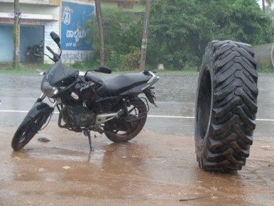 Sippy bike next to a lorry tyre. Perspective changed after this picture