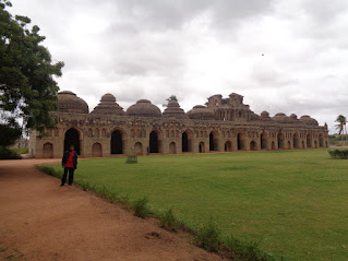 Sippy in front of the elephant stable at hampi