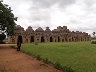 Sippy posing in front of the Elephant Stable at Hampi