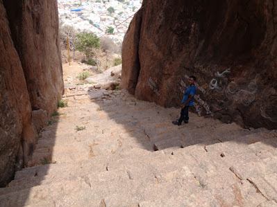 Hiker navigating back the stair way to heaven cautiously
