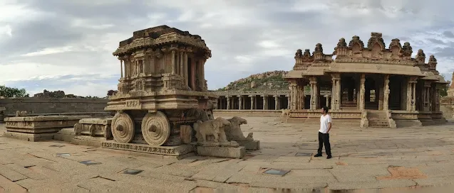 Sippy posing in front of the famous Stone Chariot at Vittala Temple, Hampi
