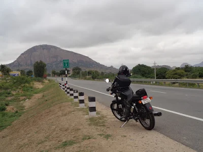 Chinmay's bike resting peacefully with Madhugiri in the background