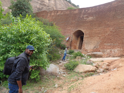 Hikers showing the most important door through which the trek actually starts