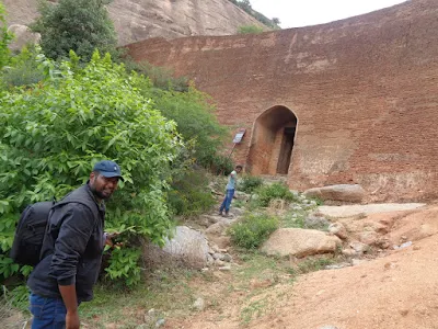 Hikers showing the most important door through which the trek actually starts
