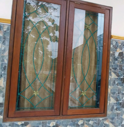 teralis jendela besi ulir motif bunga