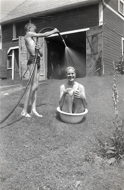 Richard Putnam and Frances Ann Cates bathing at 24 Center Street, Leeds, MA, around 1937