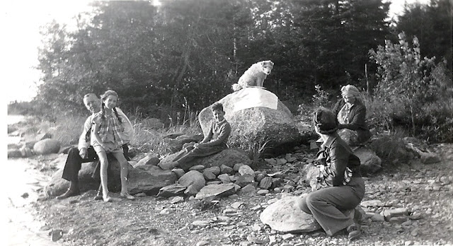 Cora, dog and Unknown group at camp