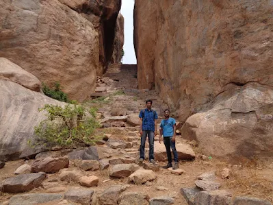 Hikers stand in front of the never ending steps to the skies at the madakasira trek